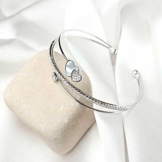 QuinShine Eternal Heart Bracelet silver open cuff with two heart charms on white fabric