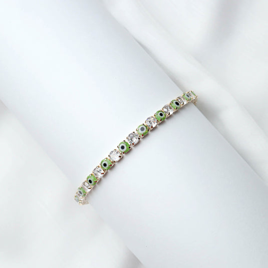QuinShine Forest Gaze tennis bracelet featuring alternating green and clear stones in a delicate design