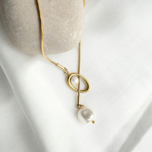 Elegant baroque pearl lariat necklace with gold chain and unique pearl design from QuinShine