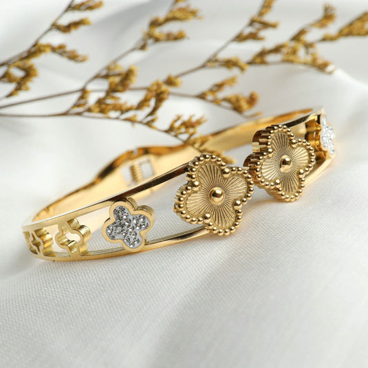 QuinShine gold clover charm bracelet with detailed floral designs and small crystal accents