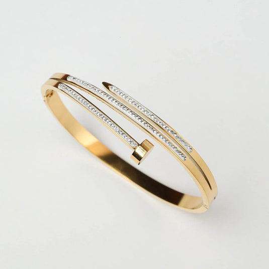 QuinShine elegant gold nail bracelet with sparkling stones on a sleek gold band