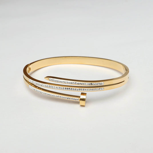 QuinShine elegant gold nail bracelet with sparkling rhinestone accents on a smooth gold band