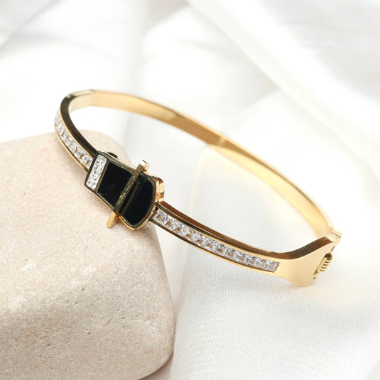 QuinShine luxury black stone bracelet with gold band and diamond accents on white fabric background