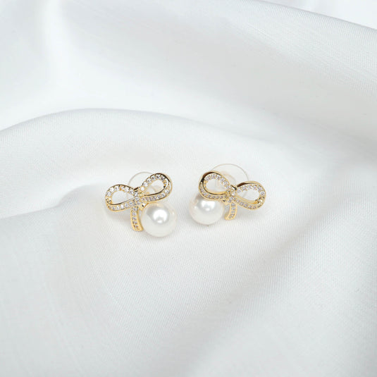 QuinShine luxury pearl earrings for women featuring gold bow design with crystal accents
