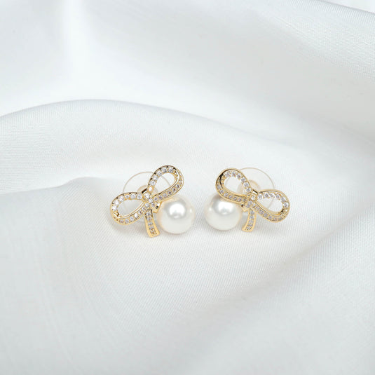 QuinShine luxury pearl earrings for women featuring gold bow design with sparkling crystals