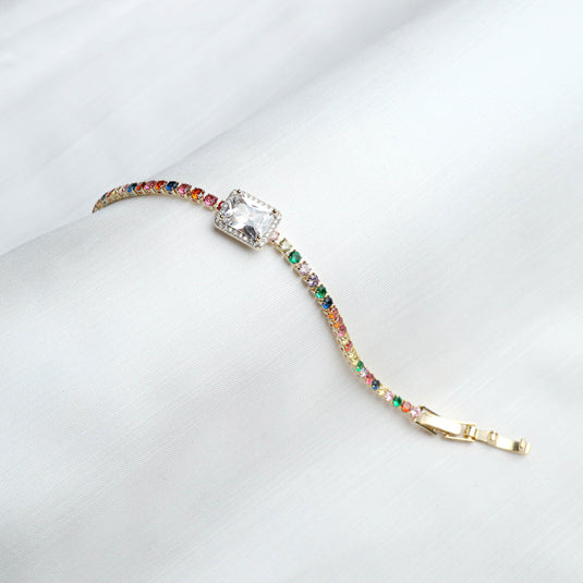 QuinShine multicolor gemstone bracelet with a large clear center stone and gold clasp