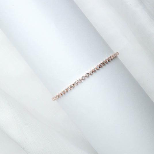 QuinShine elegant rose gold bracelet for women with small sparkling stones on white background