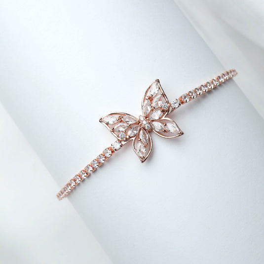 QuinShine rose gold butterfly bracelet with delicate crystal accents on a slender band