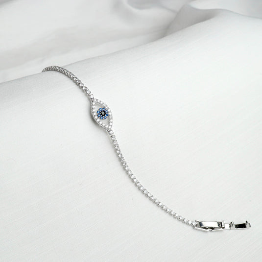 QuinShine silver sapphire eye design bracelet with blue and white stones on white background