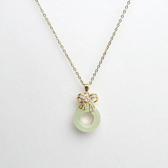 QuinShine gold chain necklace with light green round gemstone pendant and bow detail, unique gemstone jewelry