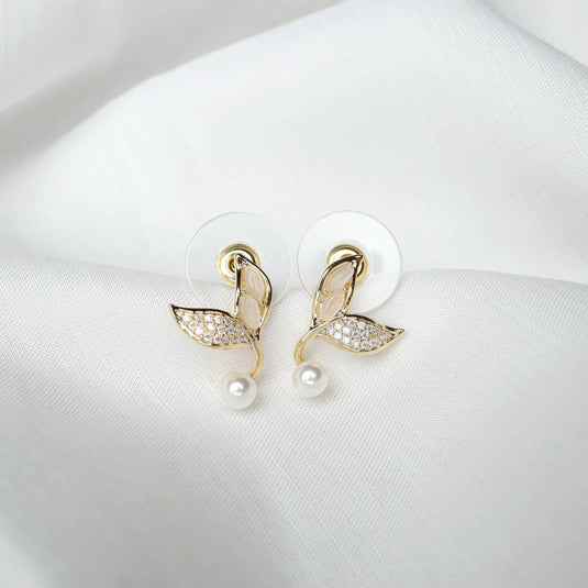 QuinShine gold vine design earrings gold with pearl and crystal detailing on white fabric