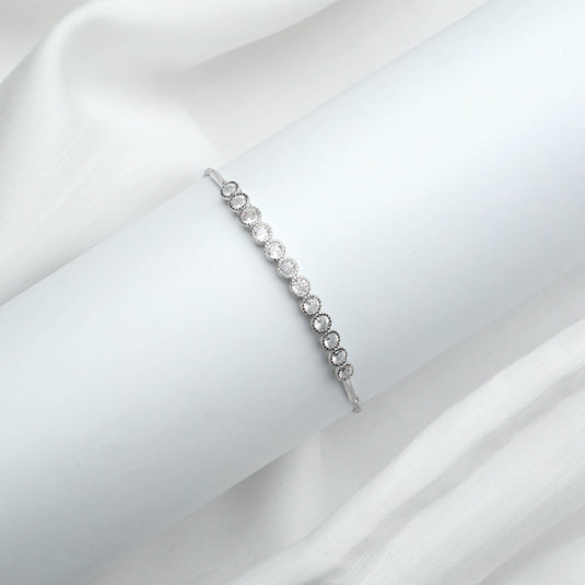 Elegant silver bracelet with round textured design available as affordable silver bracelets online from QuinShine