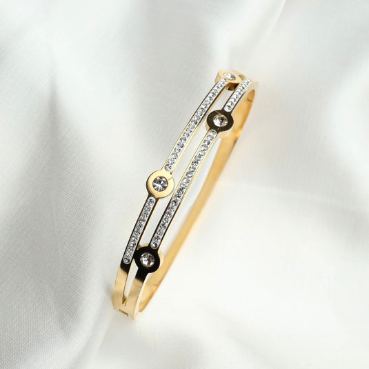Gold and black bracelet with sparkling stones featuring cosmic jewelry design by QuinShine