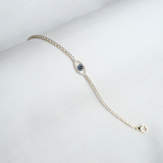 QuinShine Aura EvilEye Charm Bracelet with blue and white stones on a silver chain