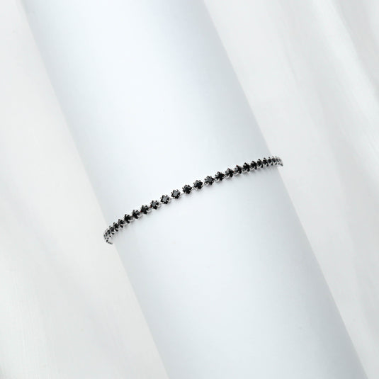 QuinShine black diamond tennis bracelet with small black diamonds set in a delicate silver chain