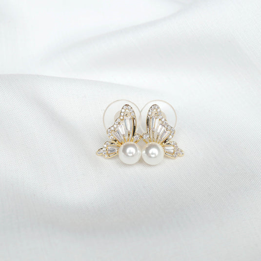 QuinShine elegant butterfly jewelry for women with pearls and crystal accents on white fabric