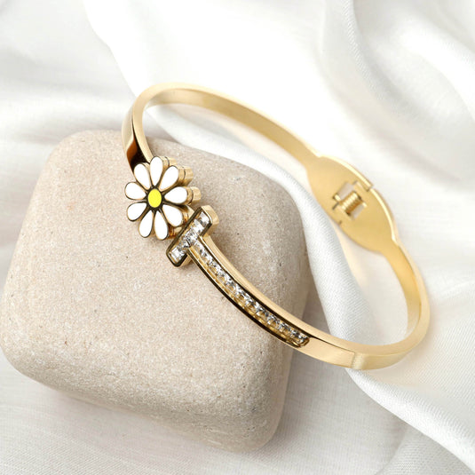 QuinShine Daisy Charm Gold Bracelet with white enamel flower and embedded crystals on gold band