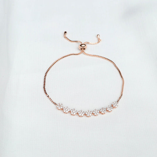 QuinShine delicate rose gold bracelet with floral crystal design and adjustable chain on white background