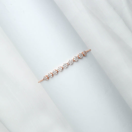 QuinShine delicate rose gold bracelet with floral diamond accents on white background