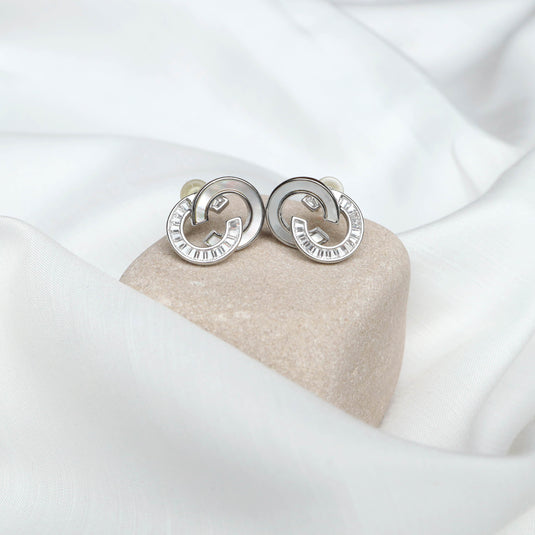 QuinShine silver designer link earrings with textured circular links on beige stone display
