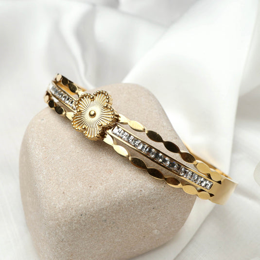 QuinShine gold bracelet featuring designer starburst jewelry with crystal accents on beige stone