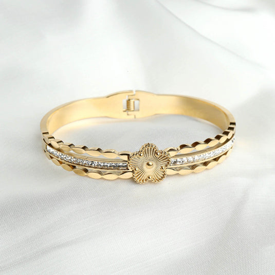 QuinShine gold bracelet featuring designer starburst jewelry with crystal accents