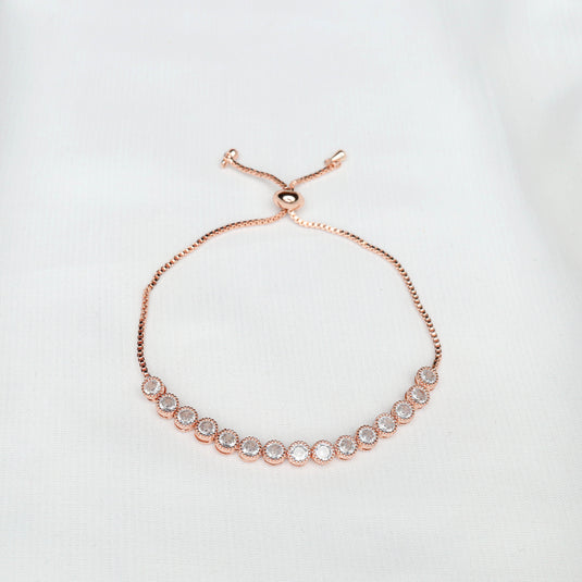 Elegant Rose Gold Adjustable Bracelet with sparkling circular stones on white background