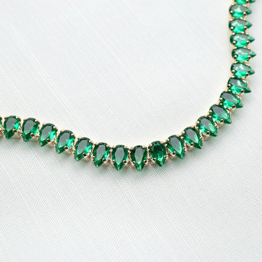 QuinShine emerald green bracelet with pear-shaped gemstones set in gold-tone metal