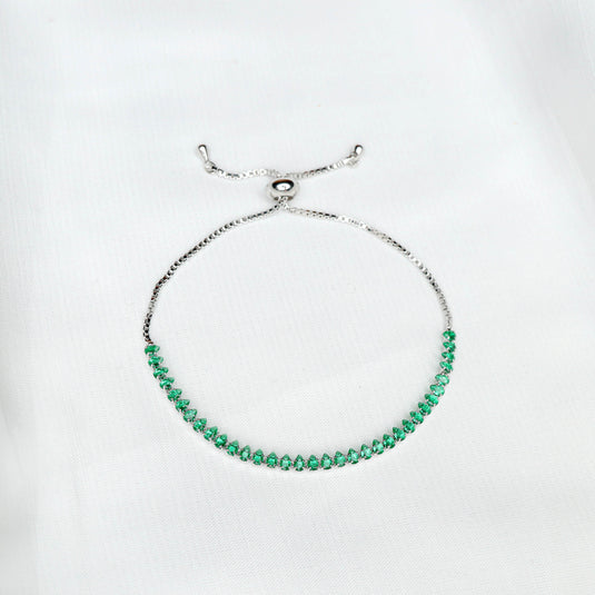 QuinShine delicate emerald tennis bracelet with adjustable silver chain on white background