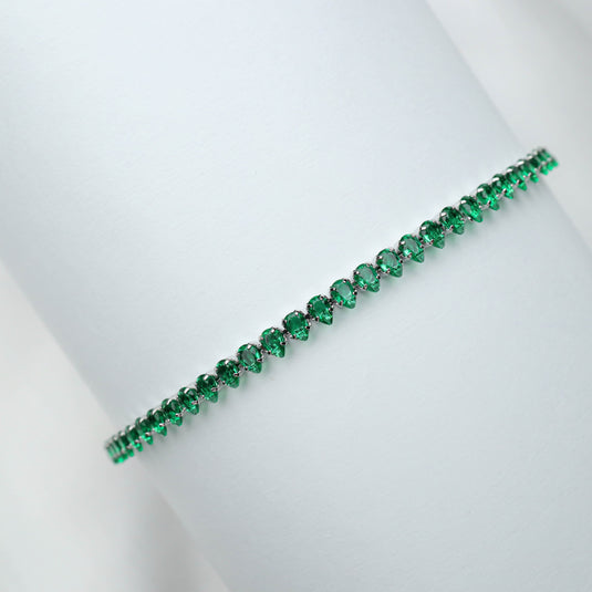 QuinShine emerald tennis bracelet with vibrant green gemstones set in a sleek design