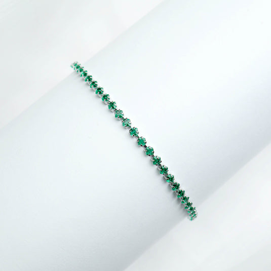 QuinShine elegant emerald tennis bracelet with vibrant green gemstones on white background
