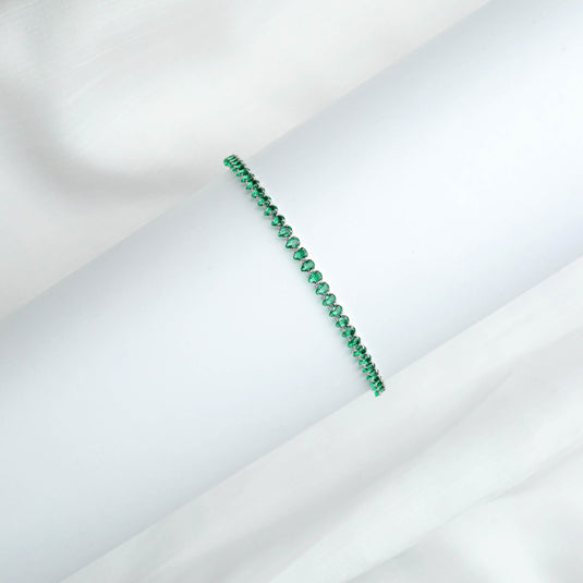 QuinShine emerald tennis bracelet with vibrant green stones set in a delicate design