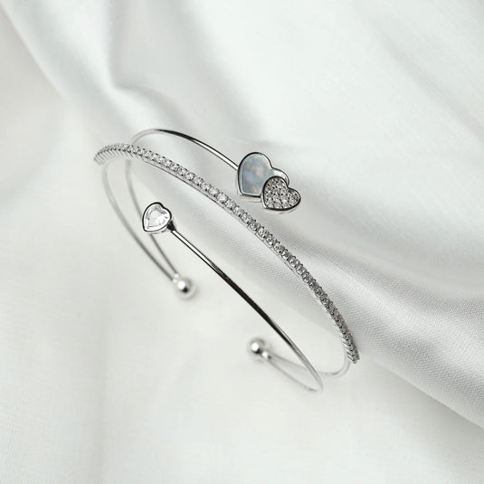 QuinShine elegant silver Eternal Heart Bracelet with twin heart charms and sparkling stones on white fabric