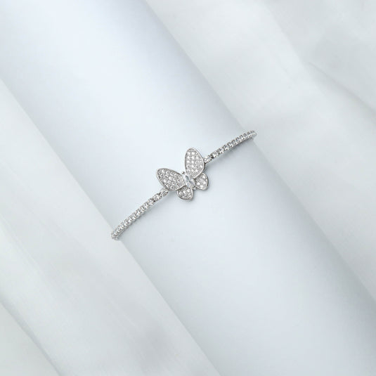 QuinShine Fluttering Radiance Bracelet featuring a sparkling butterfly charm on a delicate silver band