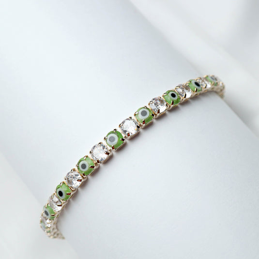 QuinShine Forest Gaze tennis bracelet featuring alternating green and clear stones on a delicate gold chain