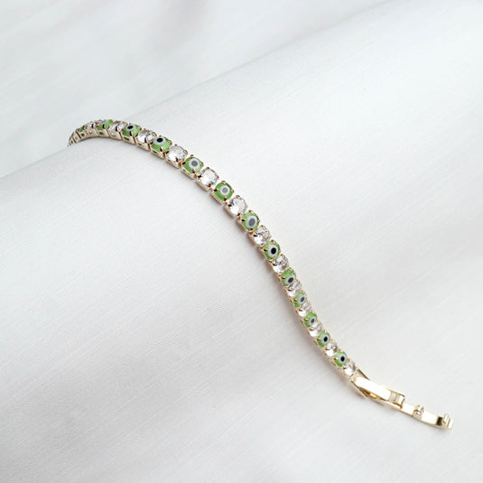 QuinShine Forest Gaze tennis bracelet with green and clear stones in gold setting