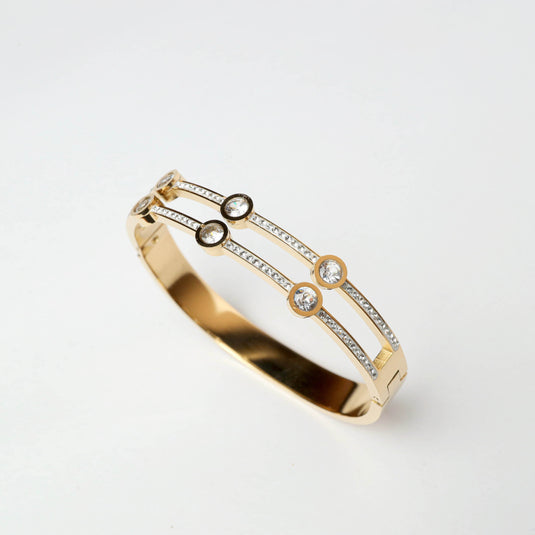 Gilded Aura Bracelet featuring elegant design with sparkling crystals and gold finish