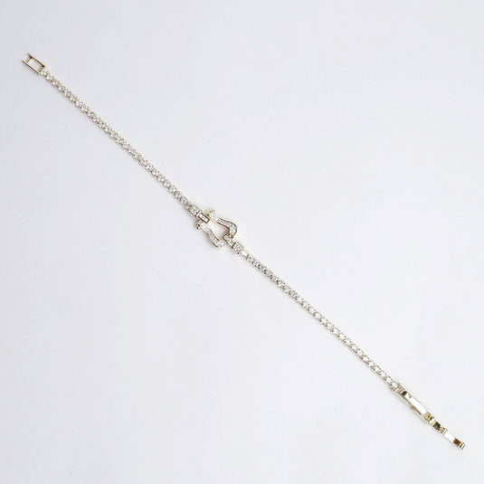 QuinShine gold arc bracelet with delicate chain and crystal embellishments on white background