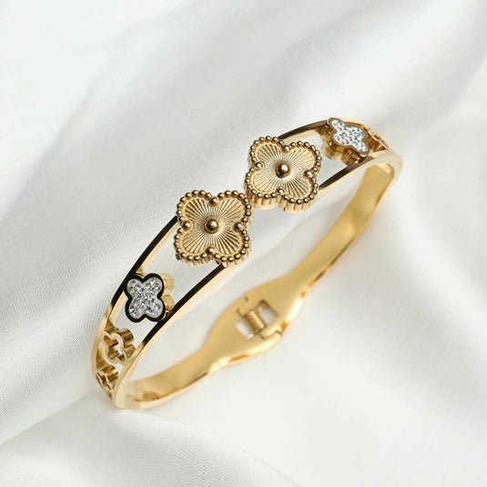 QuinShine gold clover charm bracelet with detailed flower charms and sparkling accents