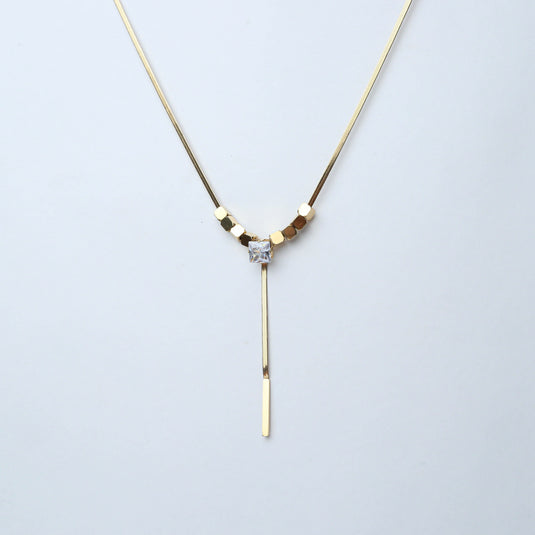 Gold diamond pendant lariat necklace with square-cut center stone and sleek bar detail