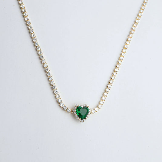 Delicate heart-shaped gold emerald jewelry necklace with sparkling border stones by QuinShine