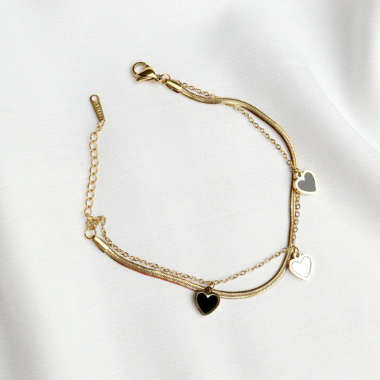 QuinShine gold heart charm bracelet with three heart-shaped pendants on layered chains