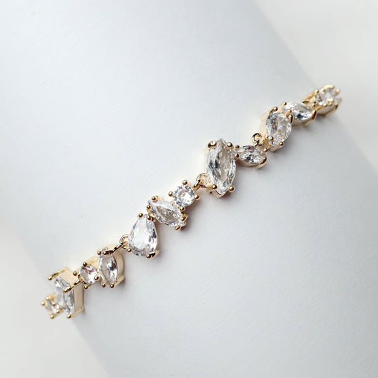QuinShine luxury tennis bracelet for women with gold setting and clear sparkling stones