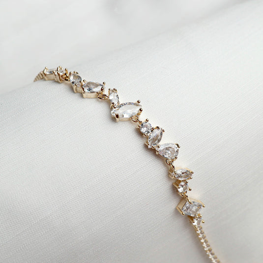 QuinShine luxury tennis bracelet for women with sparkling clear gemstones in gold setting