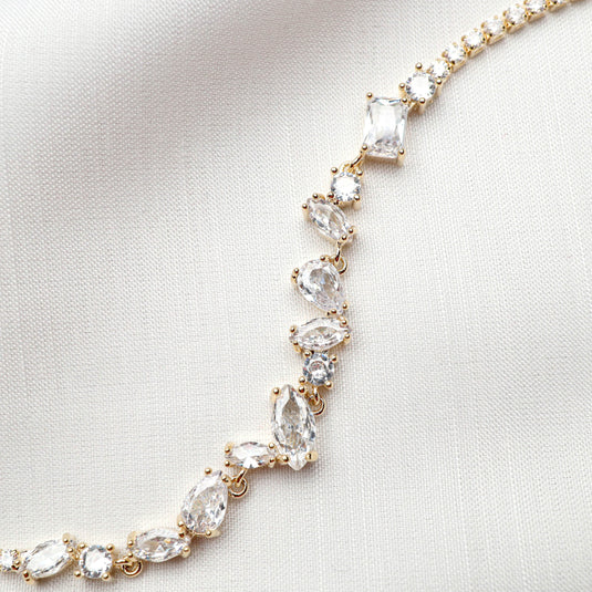 QuinShine luxury tennis bracelet for women with gold setting and clear sparkling gemstones