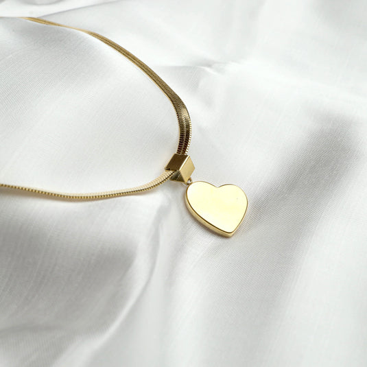 Gold minimalist heart necklace with a smooth heart pendant on a fine chain by QuinShine