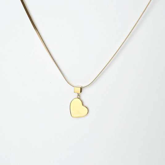 Gold minimalist heart necklace with smooth pendant on delicate chain from QuinShine online jewelry store