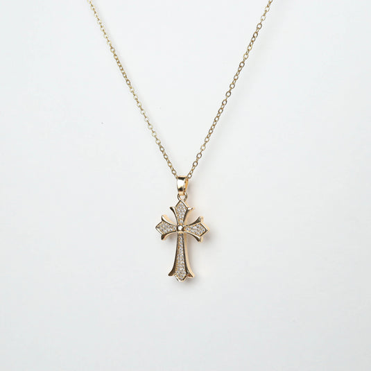 Gold pavé cross necklace with delicate chain and sparkling stone accents from QuinShine