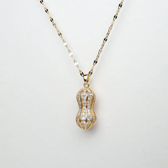 Gold peanut shell locket necklace with intricate design and sparkling stones from QuinShine