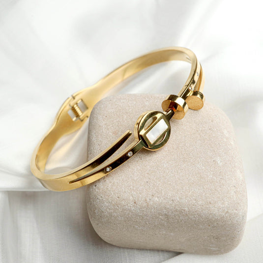 QuinShine gold-tone sleek arch bracelet with geometric design and small embedded crystals